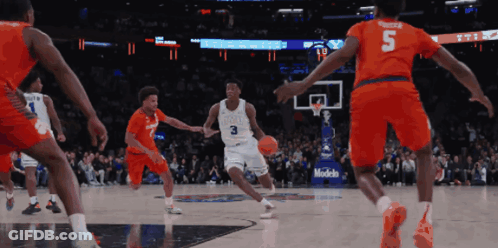 A Basketball Player With The Number 3 On His Jersey Is Dribbling The Ball GIF