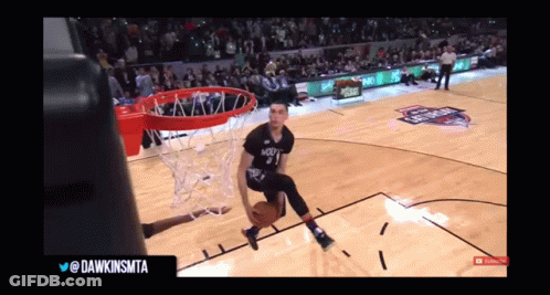 A Basketball Player With The Number 3 On His Jersey Is Going For A Dunk GIF