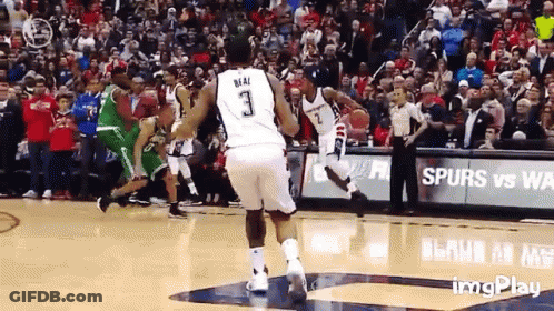 A Basketball Player With The Number 3 On His Jersey Is Jumping In The Air GIF
