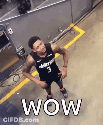 A Basketball Player With The Number 3 On His Jersey Is Standing In A Parking Lot GIF