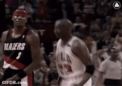 A Basketball Player With The Number 3 On His Jersey Is Standing Next To Another Player . GIF