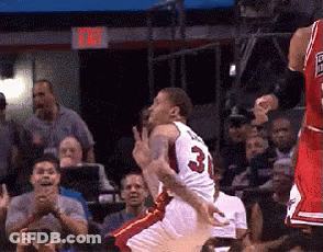 A Basketball Player With The Number 3 On His Jersey Jumps In The Air GIF