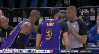 A Basketball Player With The Number 3 On His Jersey Talks To Another Player GIF