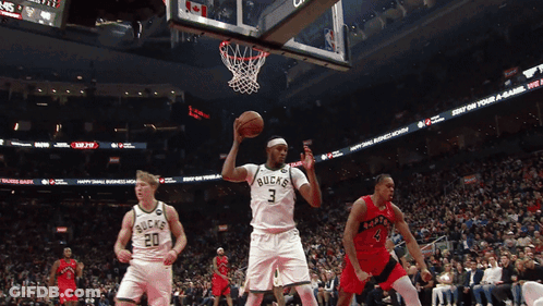 A Basketball Player With The Number 3 On His Jersey Throws The Ball GIF