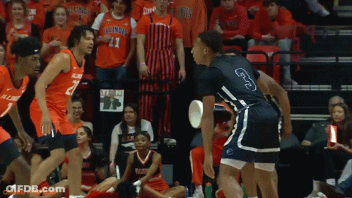 A Basketball Player With The Number 3 On His Shorts Stands In Front Of A Crowd GIF
