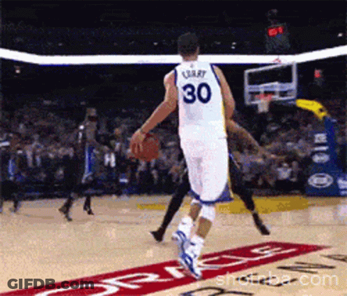 A Basketball Player With The Number 30 On His Back Dribbles The Ball GIF