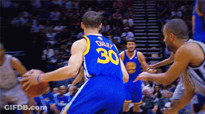 A Basketball Player With The Number 30 On His Back Dribbles The Ball GIF