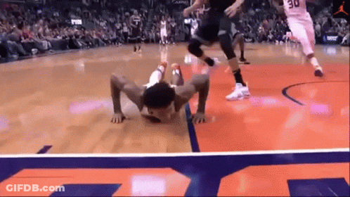 A Basketball Player With The Number 30 On His Jersey Is Crawling On The Court GIF