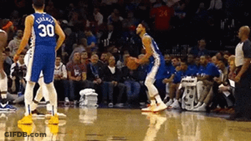 A Basketball Player With The Number 30 On His Jersey Is Dribbling A Basketball . GIF