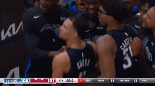 A Basketball Player With The Number 31 On His Back Is Surrounded By His Teammates GIF