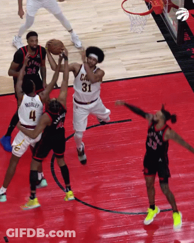 A Basketball Player With The Number 31 On His Jersey Is Trying To Get The Ball GIF
