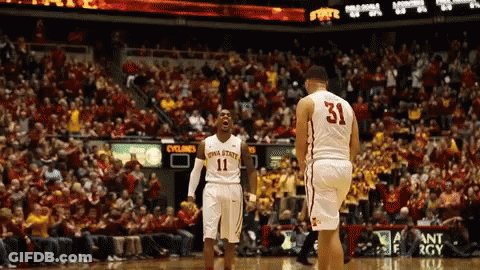 A Basketball Player With The Number 31 On His Jersey Stands Next To Another Player GIF