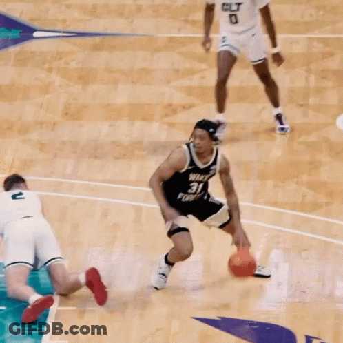 A Basketball Player With The Number 31 On His Jersey Tries To Block Another Player GIF