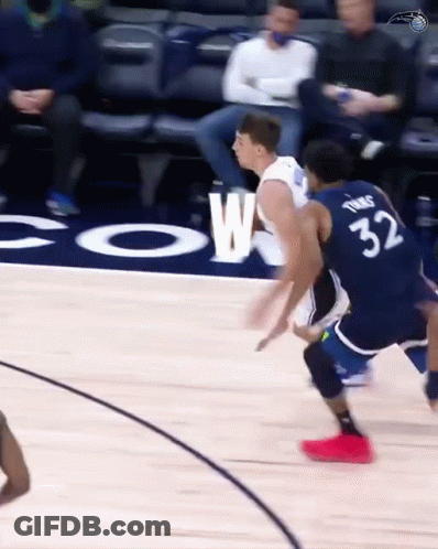 A Basketball Player With The Number 32 On His Back Is Dribbling The Ball GIF
