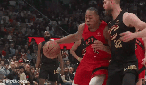 A Basketball Player With The Number 32 On His Jersey Tries To Block Another Player GIF