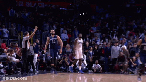 A Basketball Player With The Number 33 On His Jersey Is Running On The Court GIF