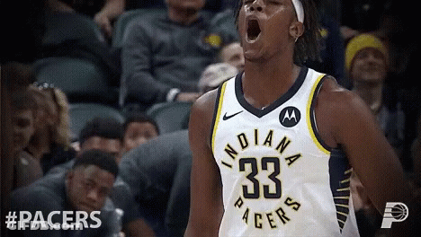 A Basketball Player With The Number 33 On His Jersey Is Screaming GIF