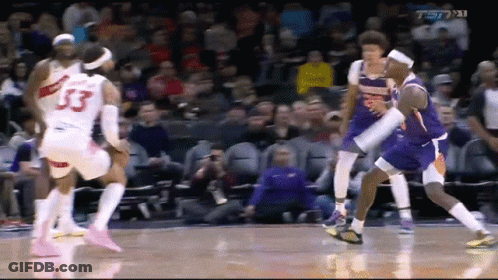 A Basketball Player With The Number 33 On His Jersey Is Surrounded By Other Players GIF