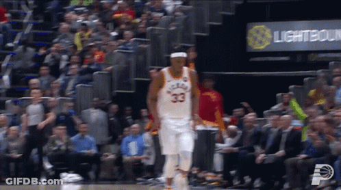 A Basketball Player With The Number 33 On His Jersey Is Walking On The Court GIF