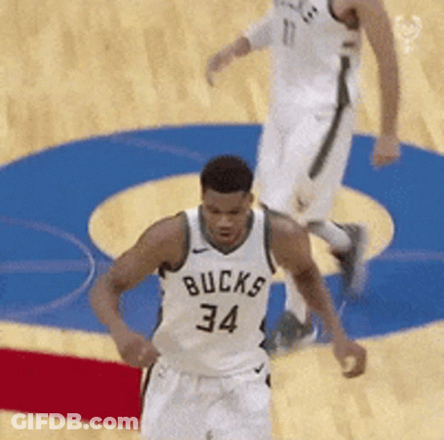 A Basketball Player With The Number 34 On His Jersey Is Running On The Court GIF