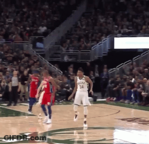 A Basketball Player With The Number 34 On His Jersey Stands On The Court GIF