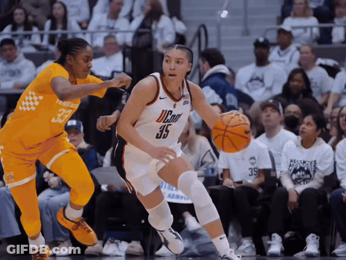 A Basketball Player With The Number 35 On Her Jersey Is Dribbling The Ball GIF