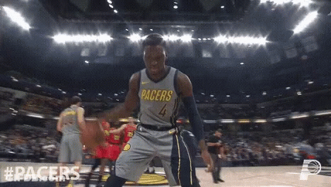 A Basketball Player With The Number 4 On His Jersey Is Dancing On The Court GIF