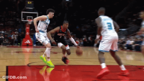 A Basketball Player With The Number 4 On His Jersey Is Dribbling The Ball GIF