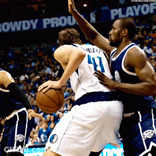 A Basketball Player With The Number 41 On His Back Dribbles The Ball GIF