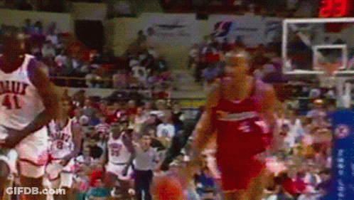 A Basketball Player With The Number 41 On His Jersey Is Being Chased By Another Player GIF