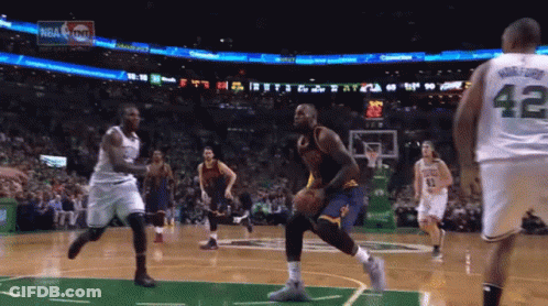 A Basketball Player With The Number 42 On His Jersey Is Dribbling The Ball GIF