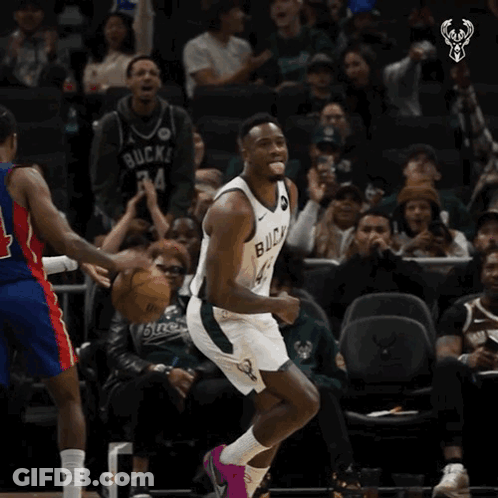 A Basketball Player With The Number 43 On His Jersey Is Celebrating GIF