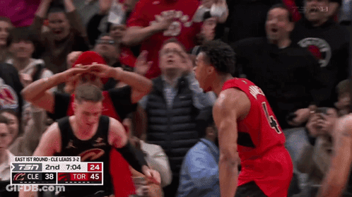 A Basketball Player With The Number 43 On His Jersey Stands In Front Of A Crowd GIF