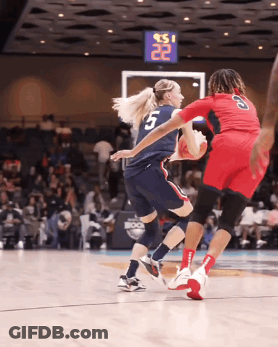 A Basketball Player With The Number 5 On Her Jersey Is Dribbling The Ball GIF