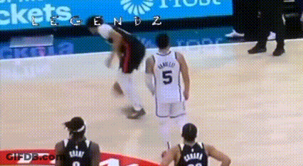 A Basketball Player With The Number 5 On His Back Is Falling On The Court GIF