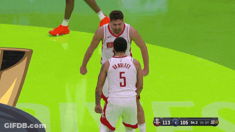 A Basketball Player With The Number 5 On His Back Stands Next To Another Player GIF