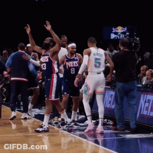 A Basketball Player With The Number 5 On His Back Stands On The Court GIF