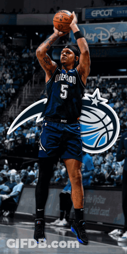 A Basketball Player With The Number 5 On His Jersey Holds A Basketball GIF