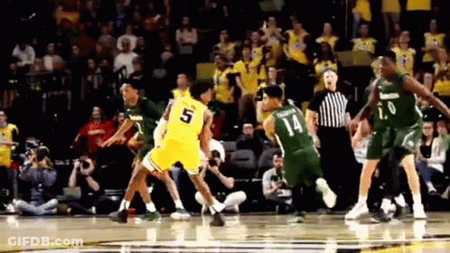 A Basketball Player With The Number 5 On His Jersey Is Being Fouled GIF