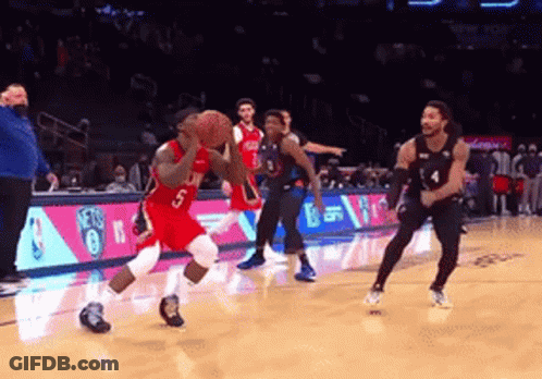 A Basketball Player With The Number 5 On His Jersey Is Dribbling A Ball GIF