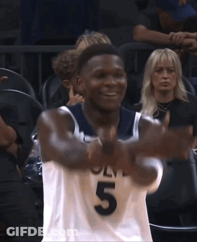 A Basketball Player With The Number 5 On His Jersey Is Smiling GIF