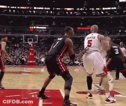 A Basketball Player With The Number 5 On His Jersey Is Standing On The Court GIF