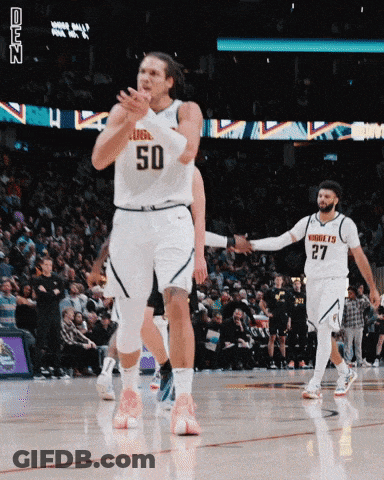 A Basketball Player With The Number 50 On His Jersey Is Clapping GIF
