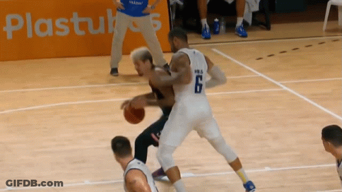 A Basketball Player With The Number 6 On His Jersey Dribbles The Ball GIF