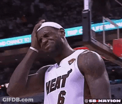 A Basketball Player With The Number 6 On His Jersey Is Holding His Head . GIF