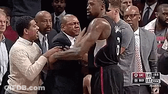 A Basketball Player With The Number 6 On His Jersey Is Standing In Front Of A Crowd . GIF