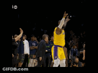 A Basketball Player With The Number 6 On His Jersey Stands In Front Of A Crowd GIF