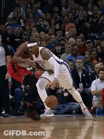 A Basketball Player With The Number 7 On His Jersey Is Dribbling The Ball GIF
