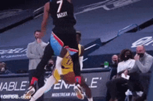 A Basketball Player With The Number 7 On His Jersey Is Jumping In The Air GIF