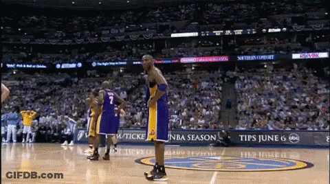 A Basketball Player With The Number 7 On His Jersey Stands On A Court GIF